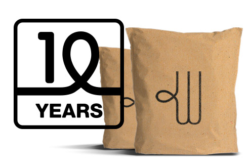 two brown Woolcool pouches with a 10 year icon in a black box