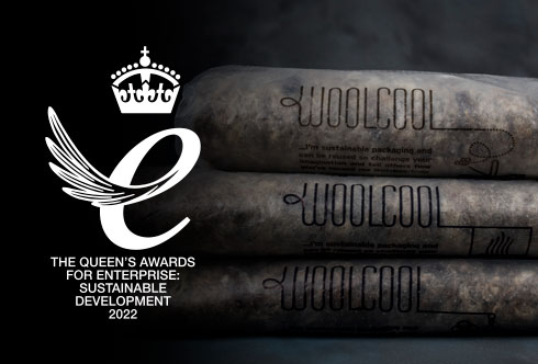 A stack of three Woolcool liners with the Queens award logo