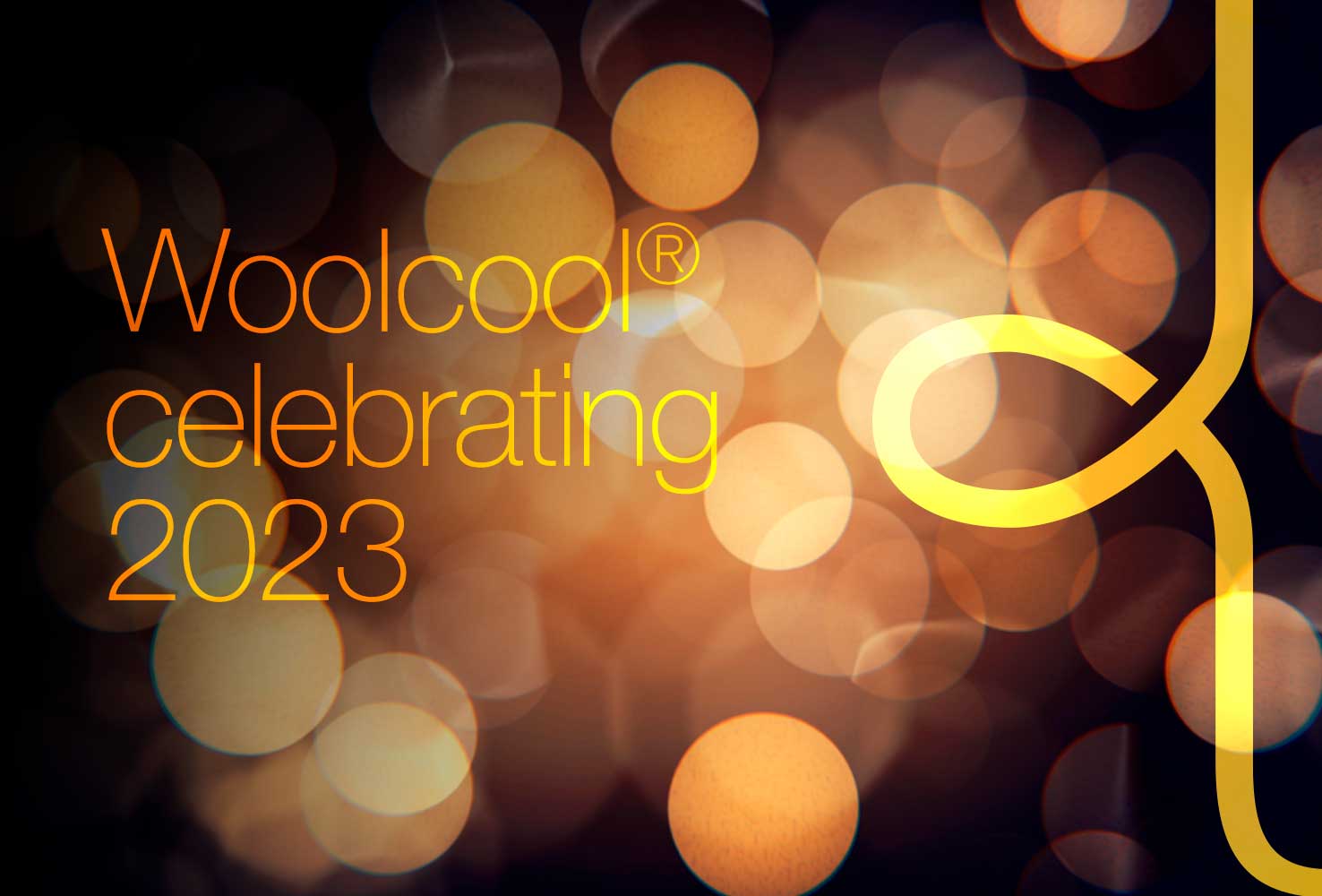 Woolcool celebrating 2023 placed on a blurred lights-style dark background, with an overlapping W from the Woolcool logo