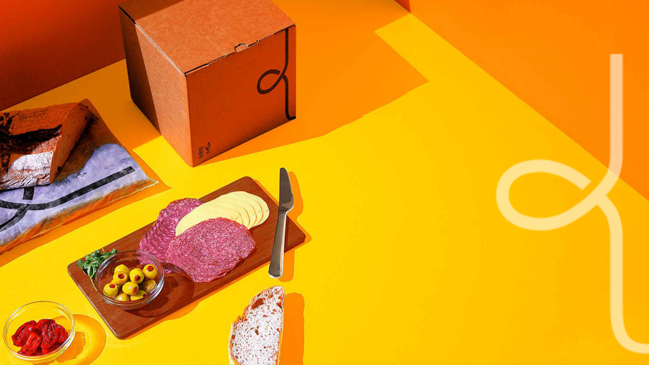 A woolcool box with some food on an orange background