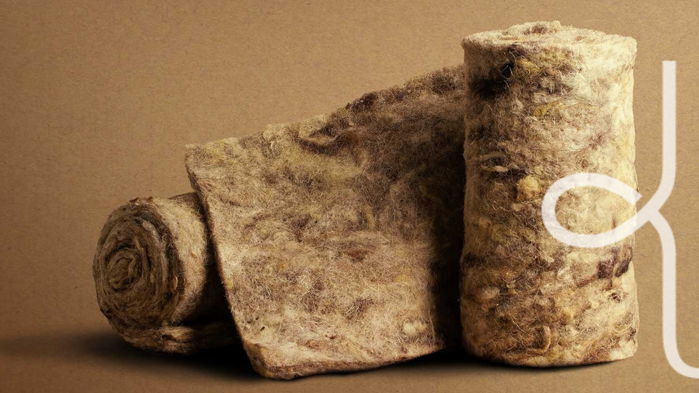 A roll of wool on a brown background